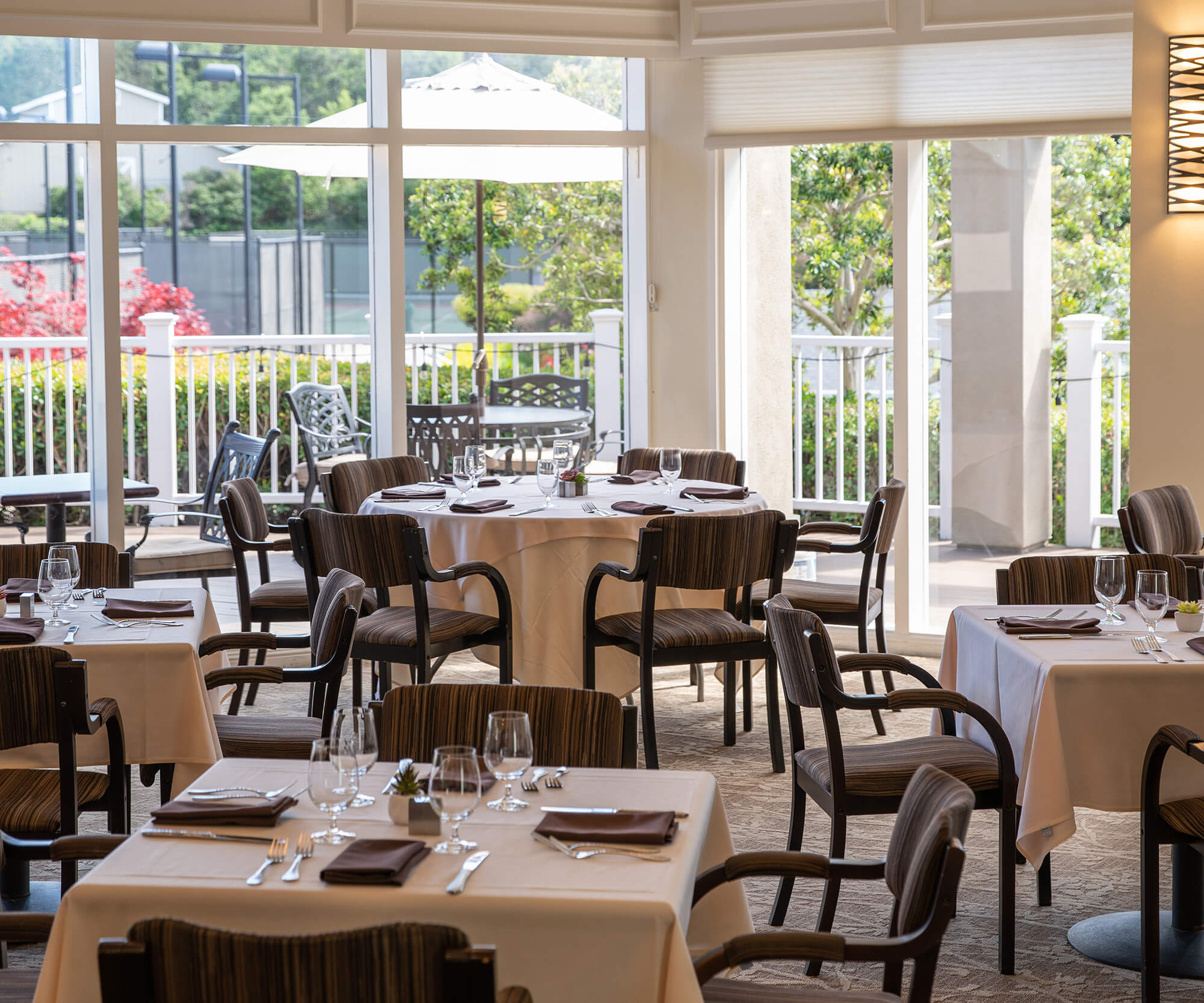 Sunlit tables and garden views at Fremont Hills Country Club